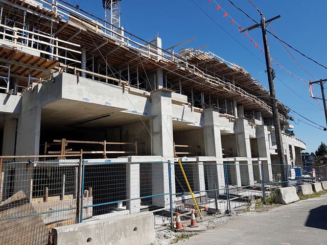 McKinnon — two and a half floors of underground parking, three levels of apartment units above grade, and one level of retail and amenity space.