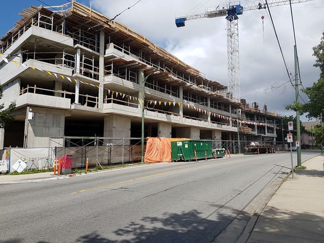 McKinnon — two and a half floors of underground parking, three levels of apartment units above grade, and one level of retail and amenity space.