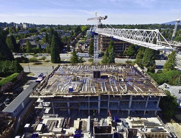 The Grayson — two floors of underground parking with six levels of apartment units above grade.
