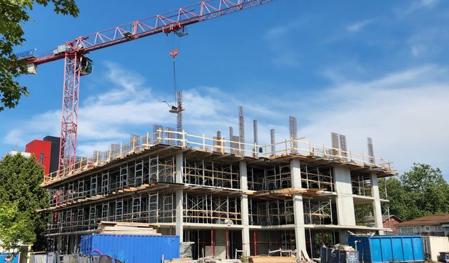 Newform crew working on a formed concrete deck with edge protection in place